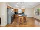This kitchen has wood cabinets, stainless appliances, an island, and black marble countertops at 3353 E Blackhawk Dr, Phoenix, AZ 85050