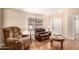 Comfortable living room showcasing hardwood floors and cozy furniture at 3353 E Blackhawk Dr, Phoenix, AZ 85050