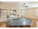 Bright open-concept living, connecting the kitchen with outdoor patio access for easy indoor-outdoor lifestyle at 3353 E Blackhawk Dr, Phoenix, AZ 85050