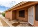 Exterior view of stucco home with a covered side entrance and desert landscaping at 3353 E Blackhawk Dr, Phoenix, AZ 85050