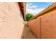 Side yard with gravel landscaping and privacy fence at 3353 E Blackhawk Dr, Phoenix, AZ 85050
