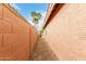 Side yard with gravel landscaping and block wall privacy fence for added security and seclusion at 3353 E Blackhawk Dr, Phoenix, AZ 85050