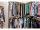 Walk-in closet featuring ample hanging storage and organized racks at 3353 E Blackhawk Dr, Phoenix, AZ 85050