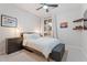 Stylish bedroom featuring a plush bed, dresser, and decoratively shelving at 3604 E Derringer Way, Gilbert, AZ 85297