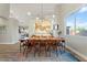 Elegant dining room with stylish lighting, a large table, and contemporary decor, perfect for gatherings at 3604 E Derringer Way, Gilbert, AZ 85297