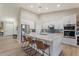 Elegant kitchen features stainless steel appliances, a central island, and white cabinetry at 3604 E Derringer Way, Gilbert, AZ 85297