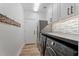 Efficient laundry room with modern washer and dryer, counter space, and ample storage at 3604 E Derringer Way, Gilbert, AZ 85297