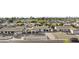 Wide aerial shot showcases a well-kept neighborhood with tidy yards and lush trees at 3754 W Hearn Rd, Phoenix, AZ 85053