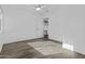 Clean bedroom with wood-look flooring, a ceiling fan, and access to other areas of the home at 3754 W Hearn Rd, Phoenix, AZ 85053