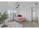 Bedroom with window, day bed, fuzzy rug, and tiled flooring; serene atmosphere with great light at 3754 W Hearn Rd, Phoenix, AZ 85053