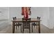 Warm dining room with wooden table, perfect for Gathering meals or entertaining guests at 3754 W Hearn Rd, Phoenix, AZ 85053