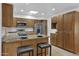 Bright kitchen with granite countertops, stainless steel appliances, and ample cabinet space at 3754 W Hearn Rd, Phoenix, AZ 85053