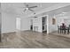 Spacious living room featuring modern wood-look flooring and an open layout at 3754 W Hearn Rd, Phoenix, AZ 85053