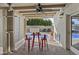 Covered patio with ceiling fan, outdoor dining, and view of the refreshing pool at 3754 W Hearn Rd, Phoenix, AZ 85053