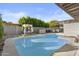 An inviting backyard pool with lounge chairs, cabana and mature landscaping at 3754 W Hearn Rd, Phoenix, AZ 85053