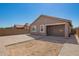 Newly built backyard includes a covered patio and brick pavers at 3815 S 64Th Ln, Phoenix, AZ 85043