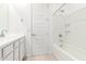 Clean bathroom featuring white vanity, door, shower and tile flooring at 3815 S 64Th Ln, Phoenix, AZ 85043