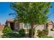 Well-maintained home featuring stone accents and a lush front yard at 3815 S 64Th Ln, Phoenix, AZ 85043