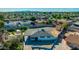 Aerial view of a home with a large, fenced backyard with a storage shed, located in a well-established neighborhood at 3944 W Wilshire Dr, Phoenix, AZ 85009