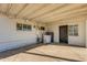 Enclosed back patio with laundry hookups and convenient access to the yard at 3944 W Wilshire Dr, Phoenix, AZ 85009