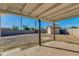 Spacious back yard featuring concrete porch and gravel area, all enclosed with a block wall at 3944 W Wilshire Dr, Phoenix, AZ 85009