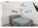 Bedroom with a ceiling fan and ample natural light from windows, carpet floors at 3944 W Wilshire Dr, Phoenix, AZ 85009