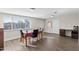 Bright dining room with laminate floors and large windows at 3944 W Wilshire Dr, Phoenix, AZ 85009