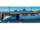 Charming single-story home with white brick and updated windows, complemented by a well-maintained front yard at 3944 W Wilshire Dr, Phoenix, AZ 85009