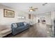 Inviting living room with modern flooring, neutral walls, comfortable seating and smooth transition to dining area at 3944 W Wilshire Dr, Phoenix, AZ 85009