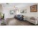 Comfortable living room with ample natural light, ceiling fan, and a neutral color scheme at 3944 W Wilshire Dr, Phoenix, AZ 85009