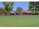 Golf course view with residential buildings in the background, and well-manicured lawn at 4039 E Paradise Dr, Phoenix, AZ 85028