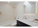 A bright bathroom features gold hardware, a lighted mirror, and a shower/tub combo at 4039 E Paradise Dr, Phoenix, AZ 85028
