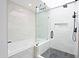 A bright bathroom features a shower with glass enclosure, a rain shower head, and a separate tub at 4039 E Paradise Dr, Phoenix, AZ 85028