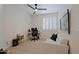 Bedroom with a ceiling fan, and a couch, offering a relaxing and functional space at 4039 E Paradise Dr, Phoenix, AZ 85028