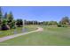 Beautiful view of a golf course featuring a pond, lush green grass, and a winding path at 4039 E Paradise Dr, Phoenix, AZ 85028