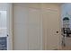 Hallway with doors, and storage cabinets, offering a clean and organized look at 4039 E Paradise Dr, Phoenix, AZ 85028