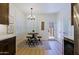 Bright kitchen nook features a round table, stools, and a window with plantation shutters at 4039 E Paradise Dr, Phoenix, AZ 85028