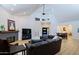 Airy living room with high ceilings, clerestory windows, fireplace, and open concept design at 4039 E Paradise Dr, Phoenix, AZ 85028