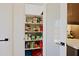 Organized pantry provides ample storage space, adjacent to the kitchen area at 4039 E Paradise Dr, Phoenix, AZ 85028