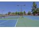 Community tennis and pickleball courts with benches and lighting, surrounded by lush landscaping at 4039 E Paradise Dr, Phoenix, AZ 85028