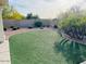 Backyard area with artificial turf and desert landscaping for low-maintenance enjoyment at 4102 E Rancho Tierra Dr, Cave Creek, AZ 85331