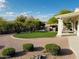 Expansive backyard featuring artificial turf, desert landscaping, and an outdoor seating area at 4102 E Rancho Tierra Dr, Cave Creek, AZ 85331