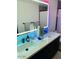 Modern bathroom features double sinks, a lighted mirror, and contemporary fixtures at 4102 E Rancho Tierra Dr, Cave Creek, AZ 85331