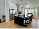Modern kitchen featuring a large island with seating, sleek countertops, and stainless steel appliances at 4102 E Rancho Tierra Dr, Cave Creek, AZ 85331