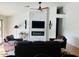 Living room featuring a fireplace, comfortable leather seating, and a modern design at 4102 E Rancho Tierra Dr, Cave Creek, AZ 85331