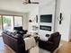 Comfortable living room featuring a modern fireplace, mounted TV, and stylish decor at 4102 E Rancho Tierra Dr, Cave Creek, AZ 85331