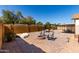 The backyard has a cozy fire pit, patio seating, and a shaded dining area at 4102 W Bluefield Ave, Glendale, AZ 85308