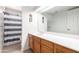 Bathroom features a spacious countertop, wood cabinets, and decorative dream catchers at 4102 W Bluefield Ave, Glendale, AZ 85308