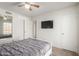 Bright bedroom with a mirrored wall and tv, providing an open feel at 4102 W Bluefield Ave, Glendale, AZ 85308
