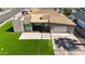 Aerial view of a beautifully landscaped home with a well-manicured lawn and a modern driveway at 4202 E Catalina Dr, Phoenix, AZ 85018